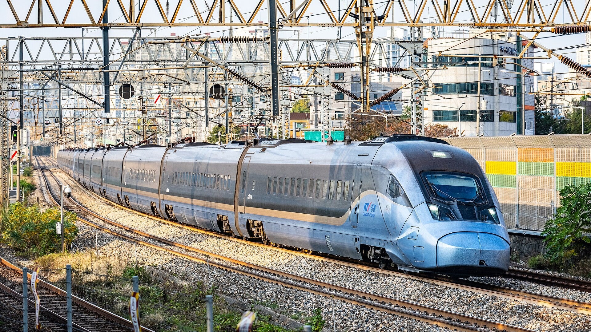 How to book KTX as a foreigner: a KTX-Cheongryong train curving through Seoul in late-afternoon light