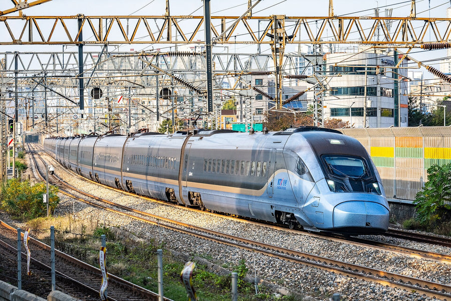 How to book KTX as a foreigner: a KTX-Cheongryong train curving through Seoul in late-afternoon light