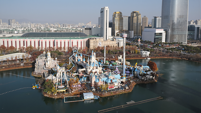 Lotte World Halloween season in Seoul: Magic Island's castle rides on Seokchon Lake under clear autumn light