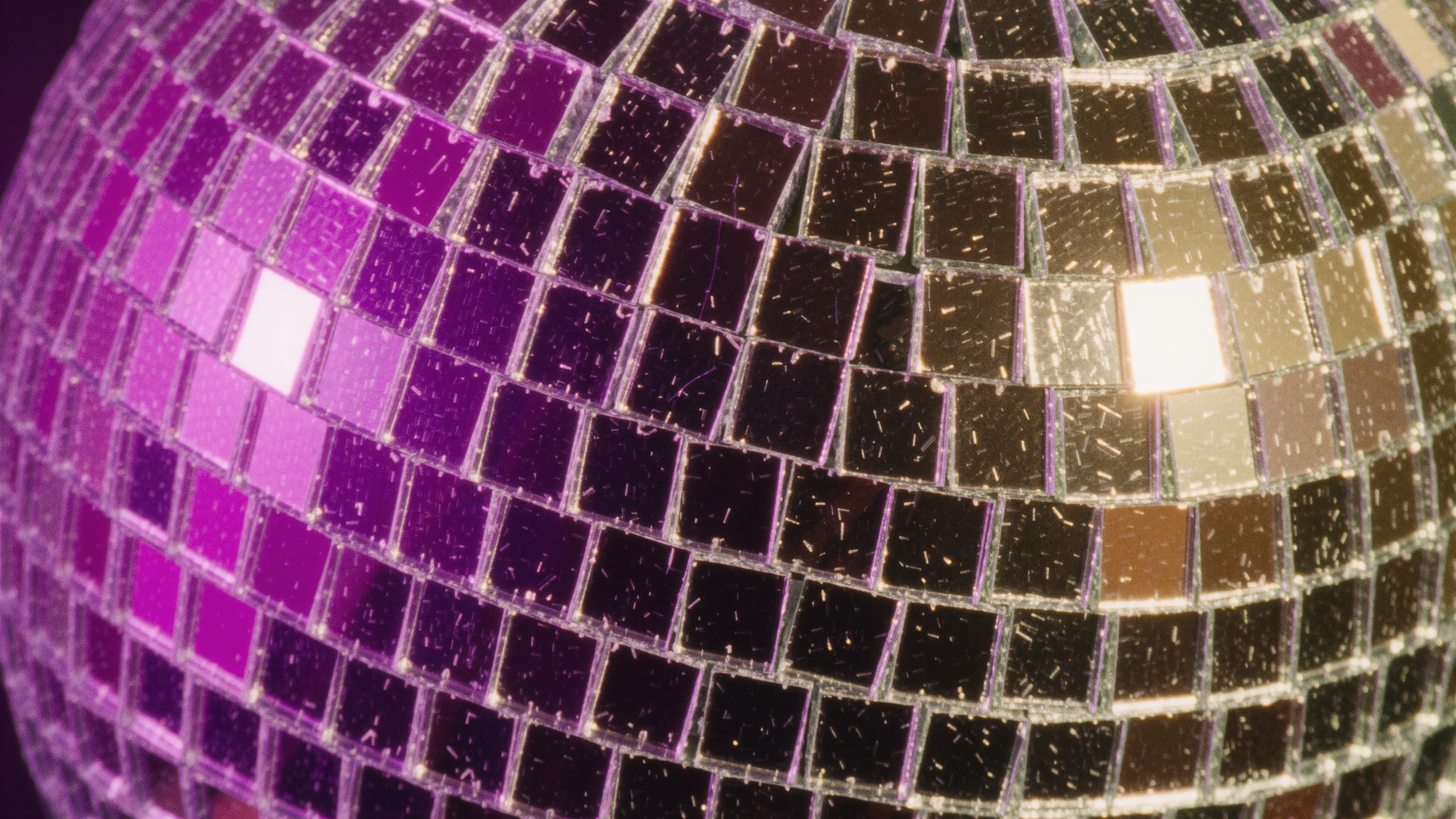 Mirrored disco ball scattering colorful squares of light