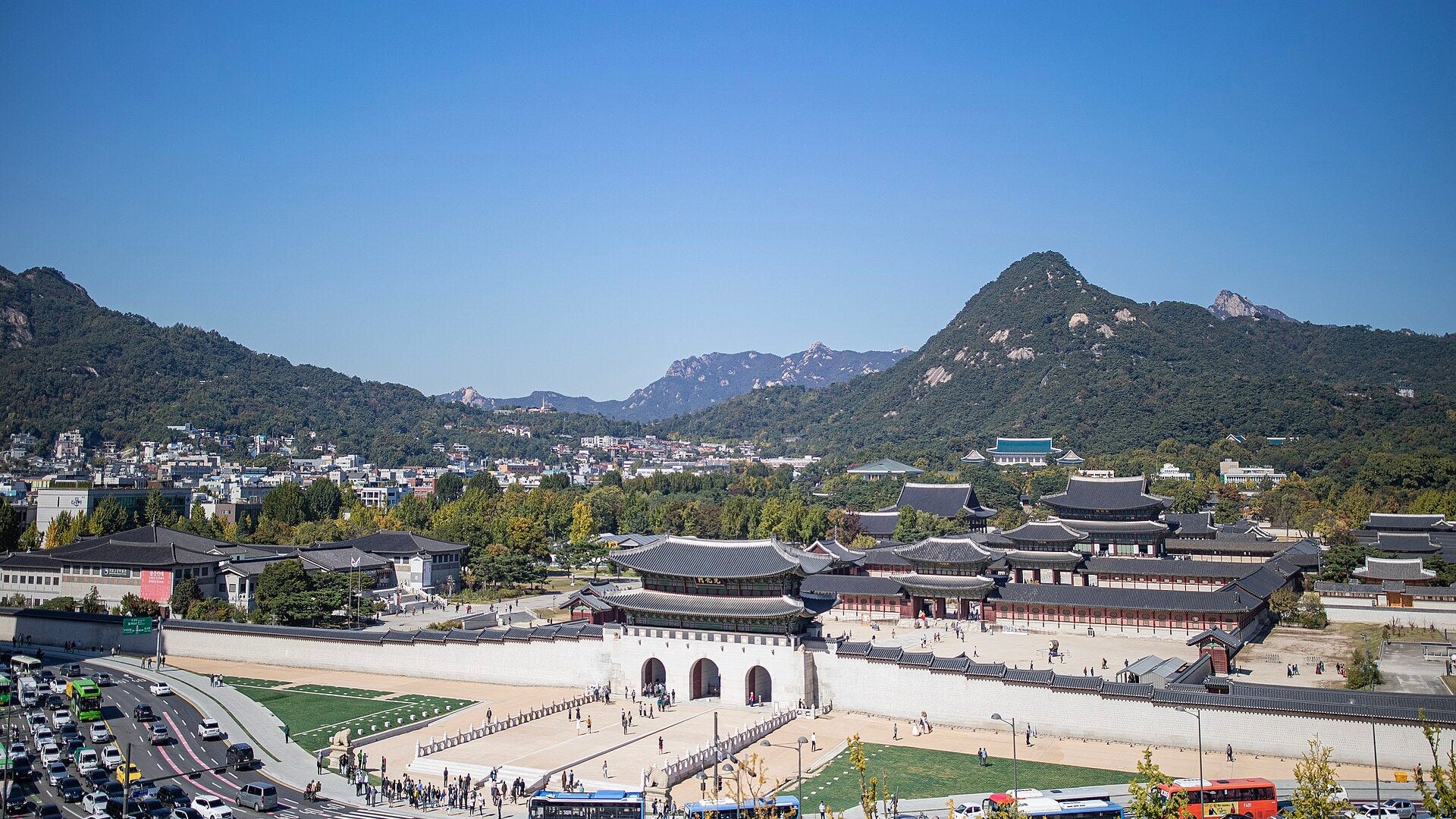 Gwanghwamun gate and Gyeongbokgung Palace below Bugaksan mountain in Seoul on a clear autumn day