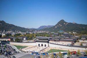 Gwanghwamun gate and Gyeongbokgung Palace below Bugaksan mountain in Seoul on a clear autumn day