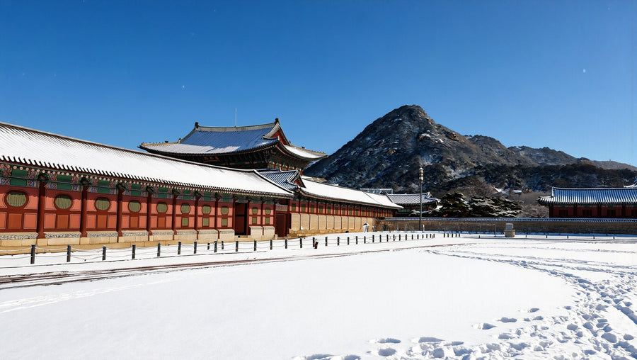 Gyeongbokgung Palace and Bugaksan under fresh snow on a bright, clear winter day in Seoul