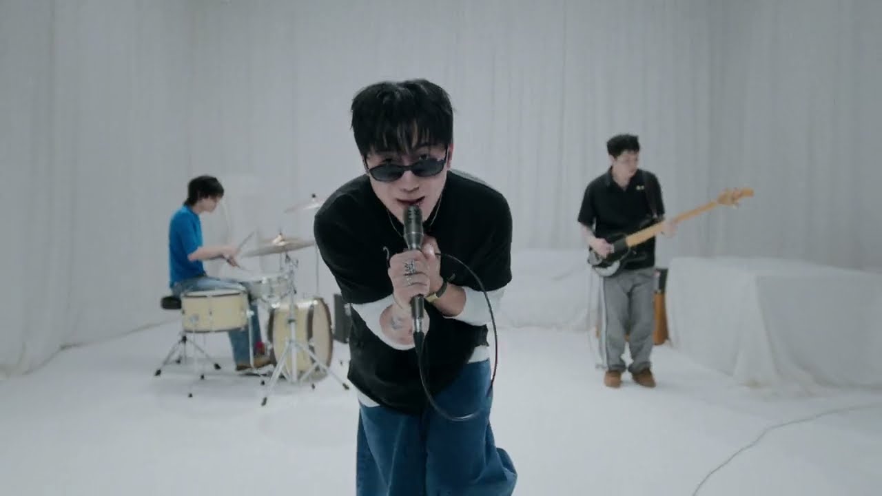 The Poles performing 'Echo! (talk to me baby)' in a white-curtained music video (The Poles Official YouTube)