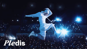 A TWS member leaps above a sea of glowing lightsticks on a concert stage in the Being Together : TO US video