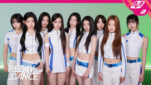 A2O LITE's nine members posing in white and blue NEON stage outfits for M2's Relay Dance