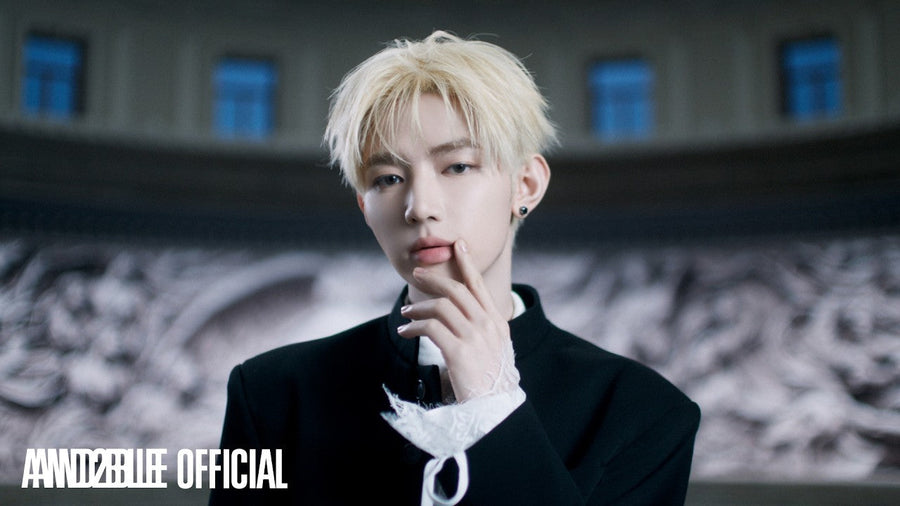An AND2BLE member with platinum hair in the 'French Kissing' music video teaser (AND2BLE Official YouTube)