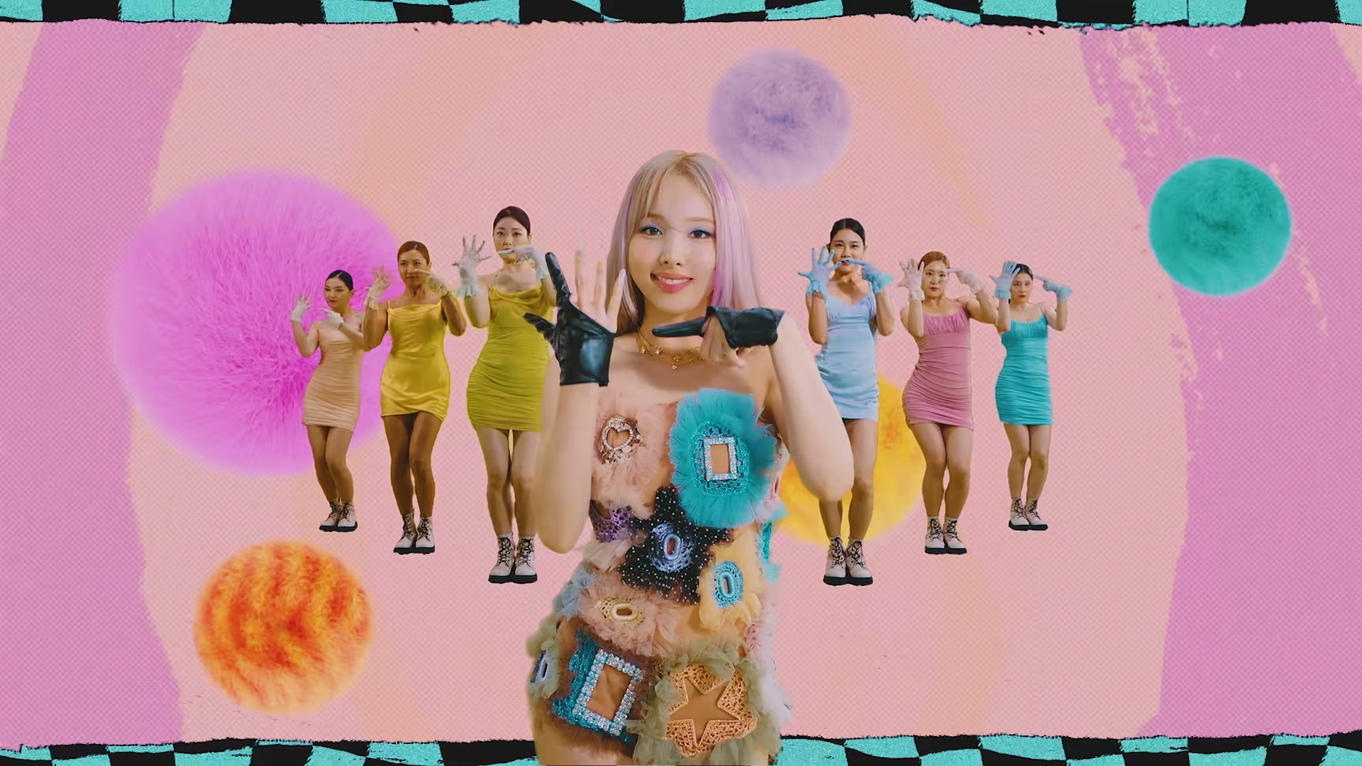 Nayeon dancing among pastel fur balls in the bright pink POP! music video (JYP Entertainment Official YouTube)