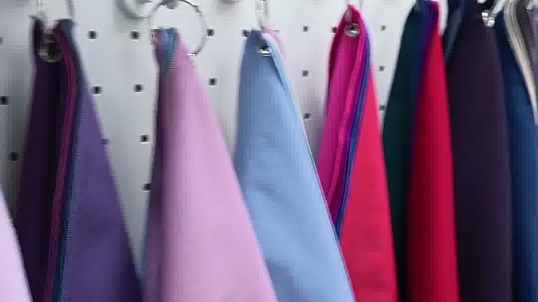 Personal color analysis drapes in purple, lilac, blue and red hanging in a Seoul studio (MyColorLab Official YouTube)